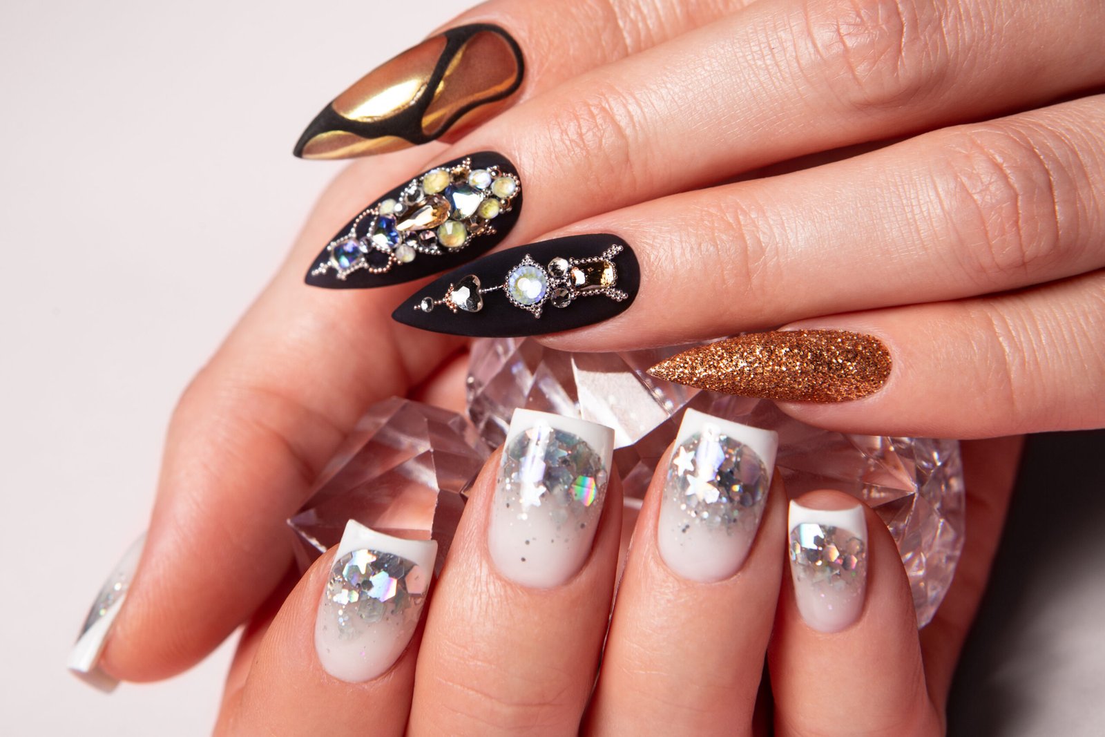 Two different manicures, black and white. . High-quality photo